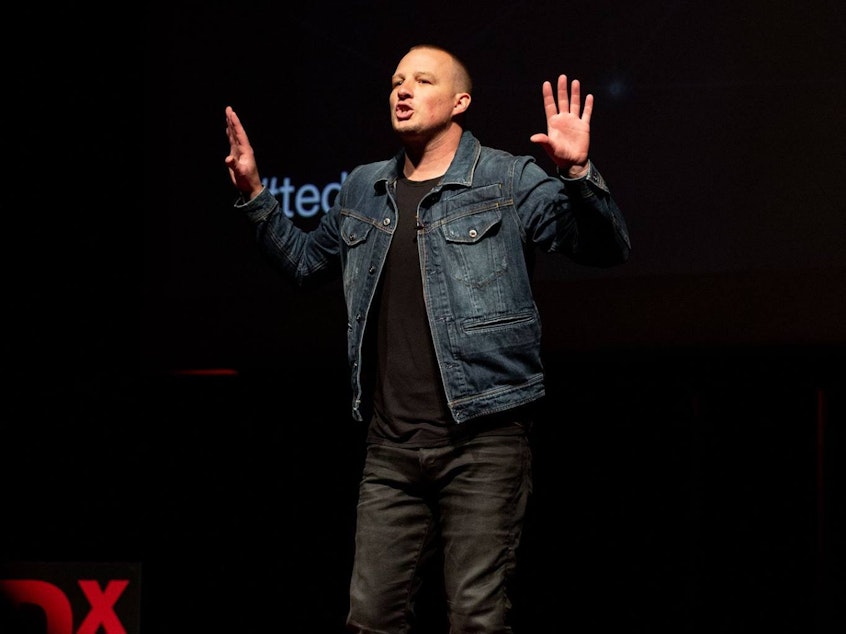 caption: Travis Jones on the TED stage.