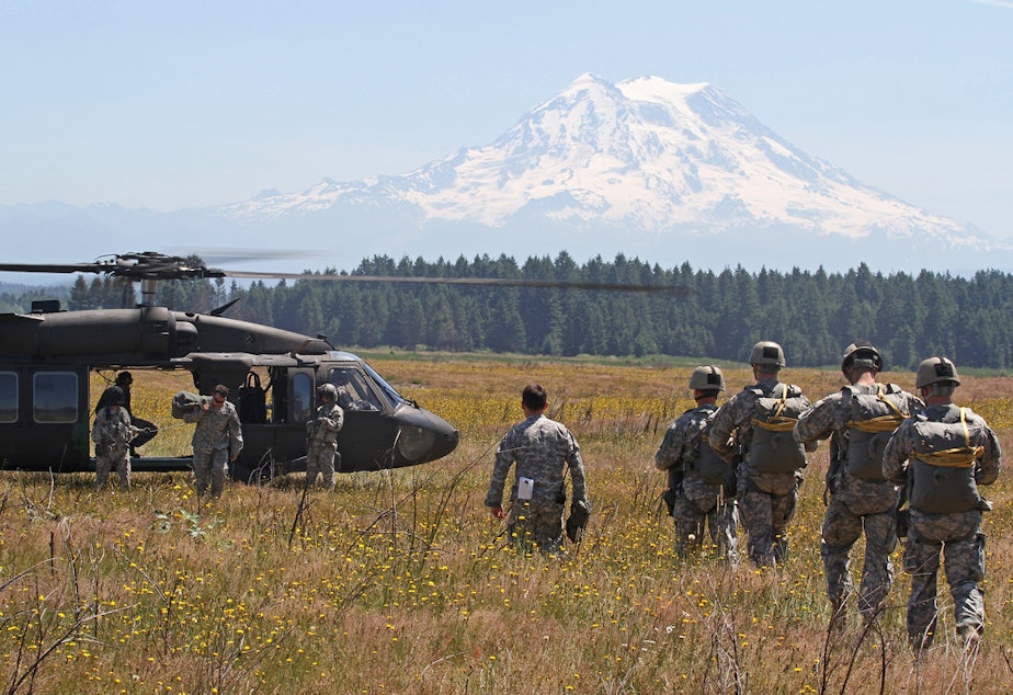 caption: Soldiers prepare for static-line jumps from Blackhawk helicopters at Joint Base Lewis-McChord in this photo dated June 17, 2015.