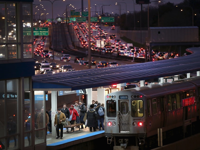 caption: In Chicago, the Kennedy Expressway is clogged with cars as rush-hour commuters and Thanksgiving holiday travelers mix on Wednesday — one of the busiest travel days of the year.
