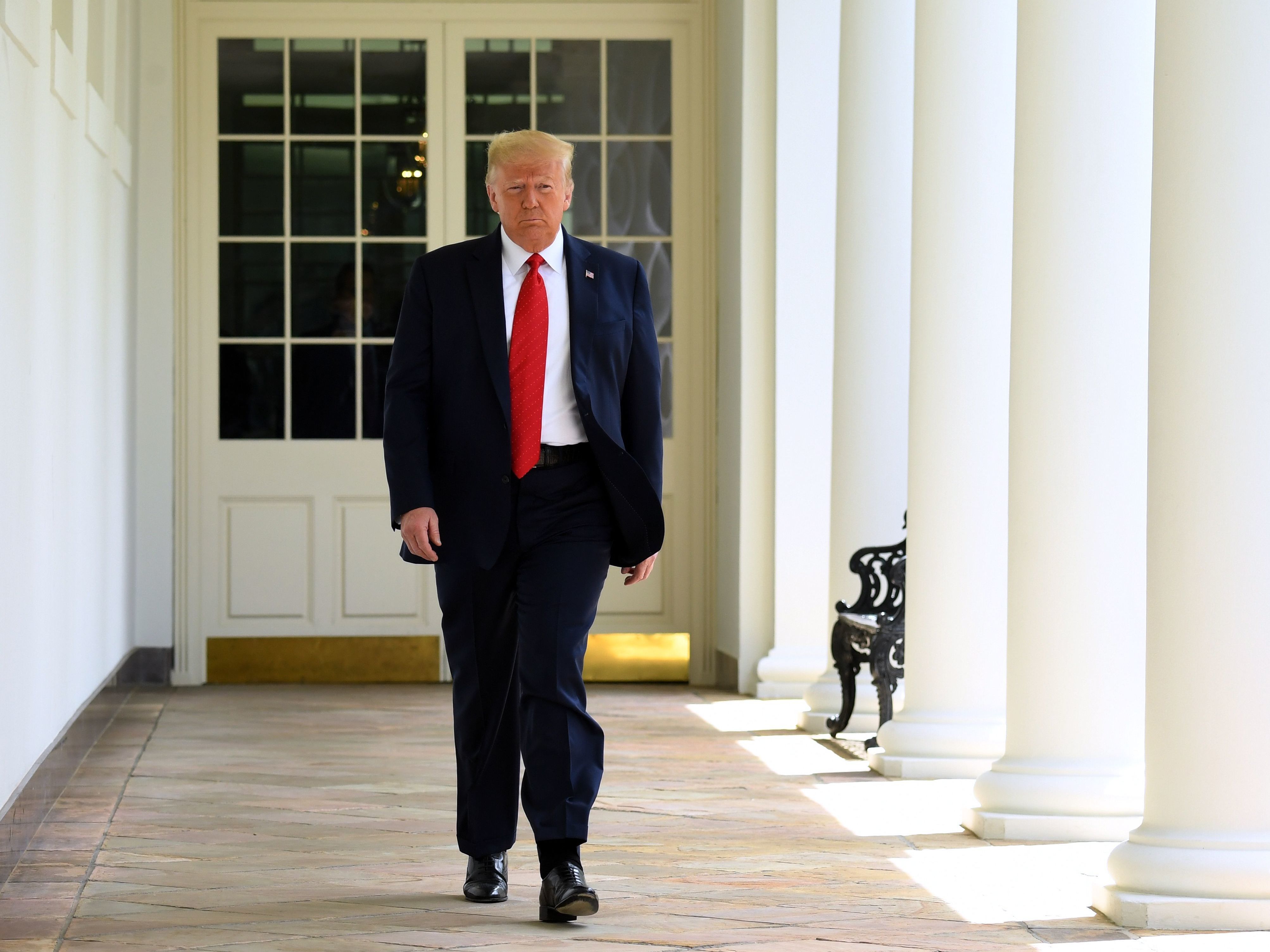 caption: President Trump arrives to sign an executive order on police reform in the Rose Garden on June 16, 2020.