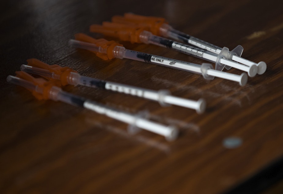 caption: Doses of the Pfizer Covid-19 vaccine are shown ready to administer to students over the age of 12, on Tuesday, May 18, 2021, at Memorial Stadium in Seattle.