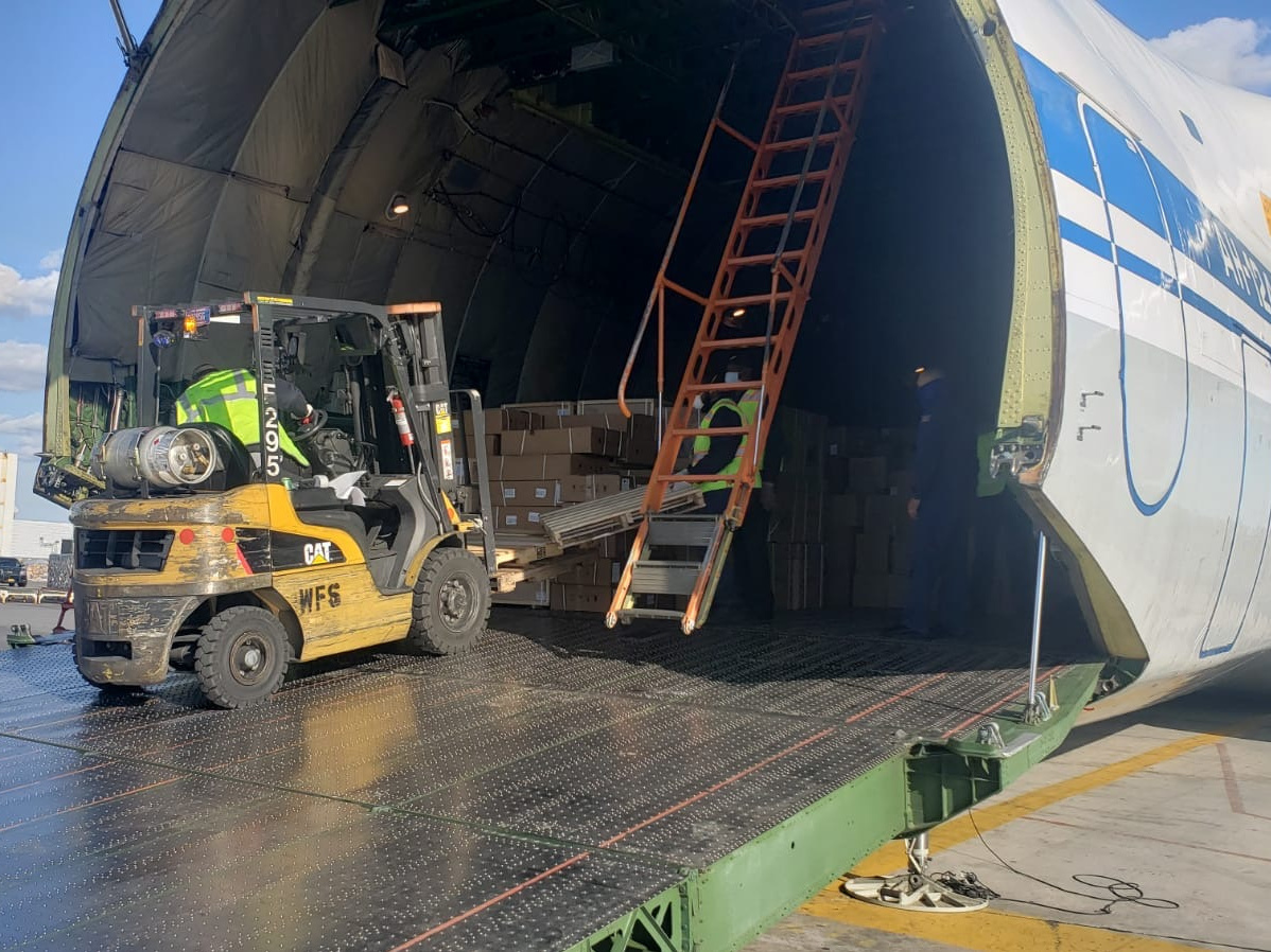 caption: A Russian plane carrying medical equipment arrives at John F. Kennedy International Airport in New York City.