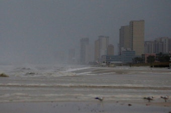 caption: Strong surf is seen at Panama City Beach on Wednesday morning, as Hurricane Michael approaches the Florida Panhandle.