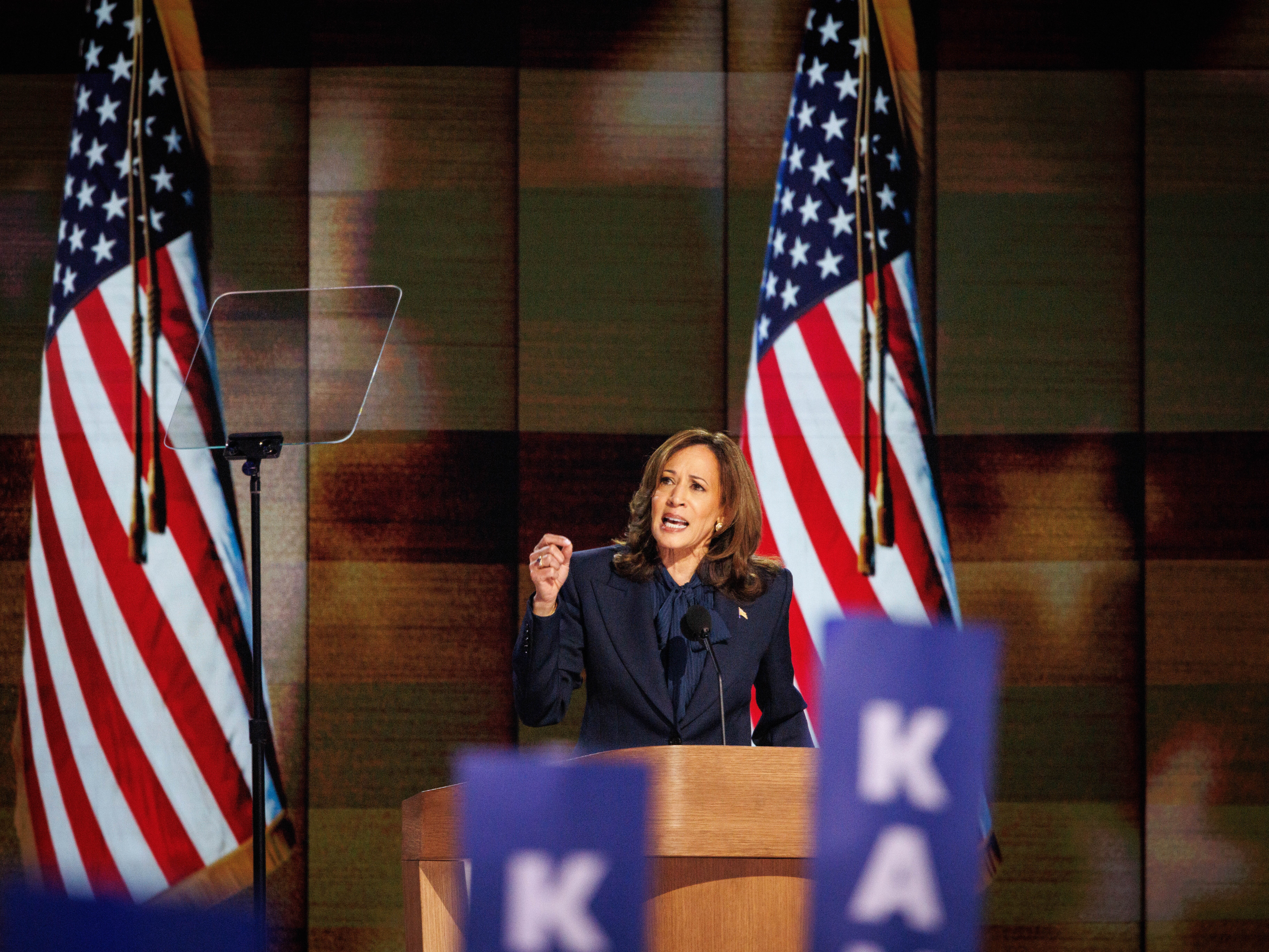 caption: U.S. Vice President Harris speaks at the 2024 Democratic National Convention at the United Center on Aug. 22 in Chicago.