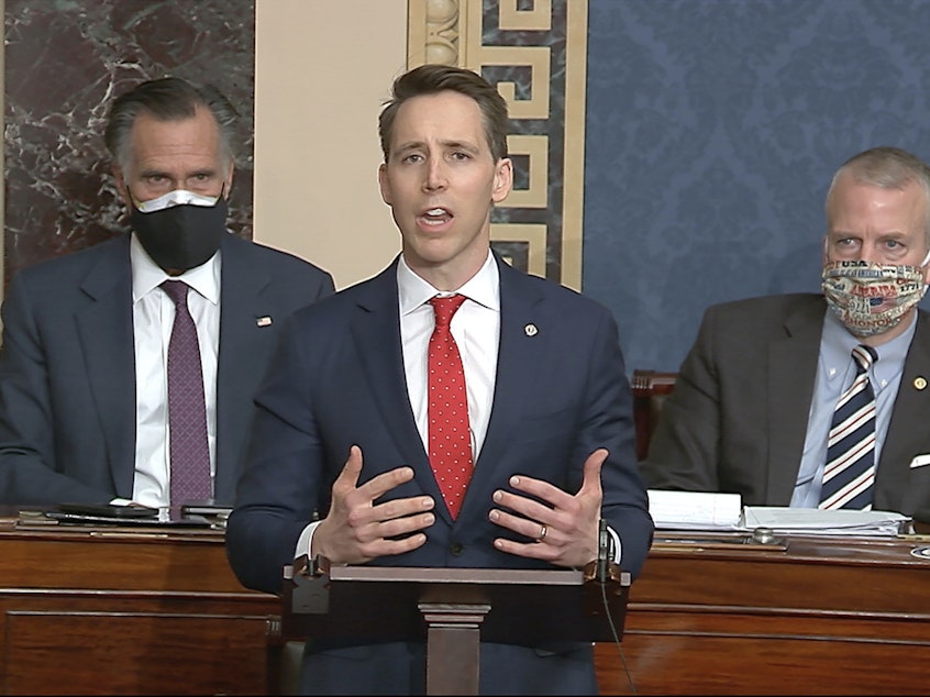 caption: Sen. Josh Hawley, R-Mo., speaks during a Senate debate on whether to confirm the Electoral College vote, after protesters stormed the U.S. Capitol on Wednesday.