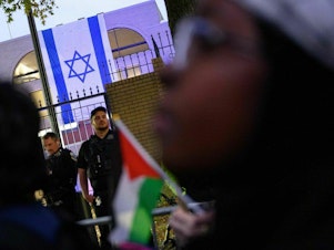 caption: Demonstrators rally in support of Palestinians in front of the Israeli embassy in Washington, D.C., on Oct. 18.
