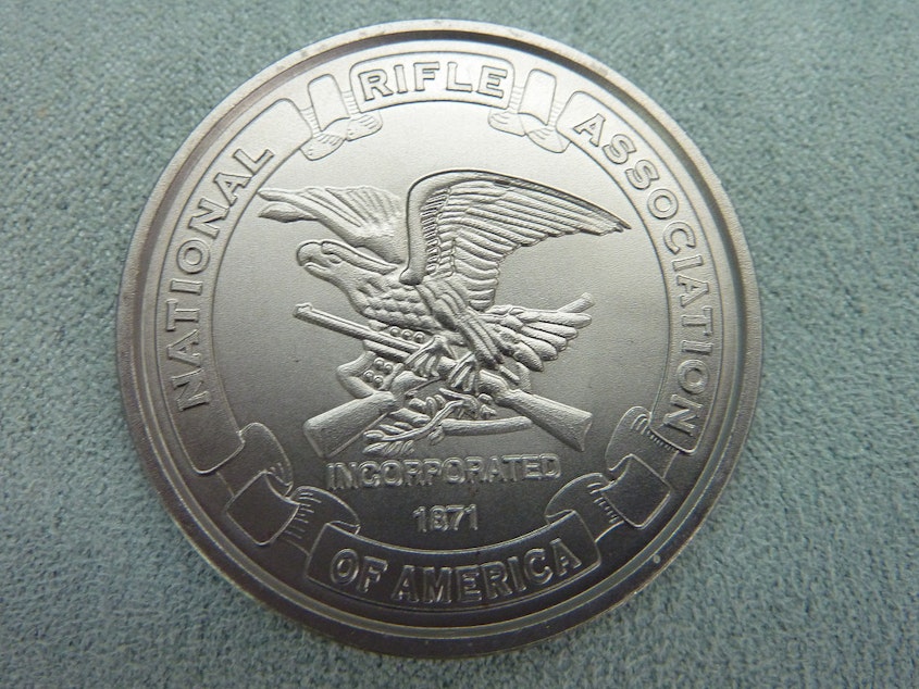 caption: A commemorative coin by the National Rifle Association.