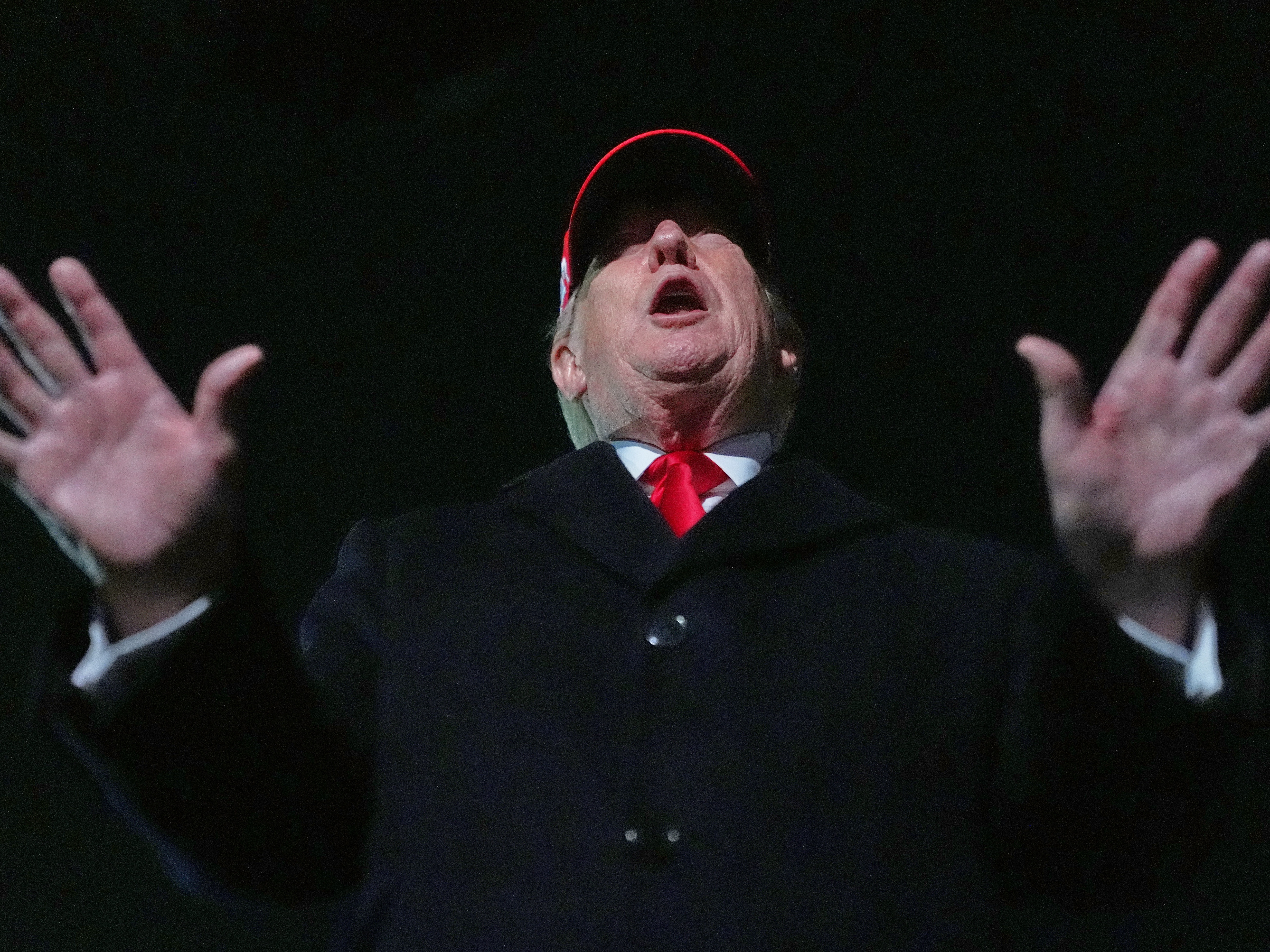caption: President Donald Trump speaks with reporters at Joint Base Andrews, Md., Sunday, April 12, 2026, after he returned from Miami.