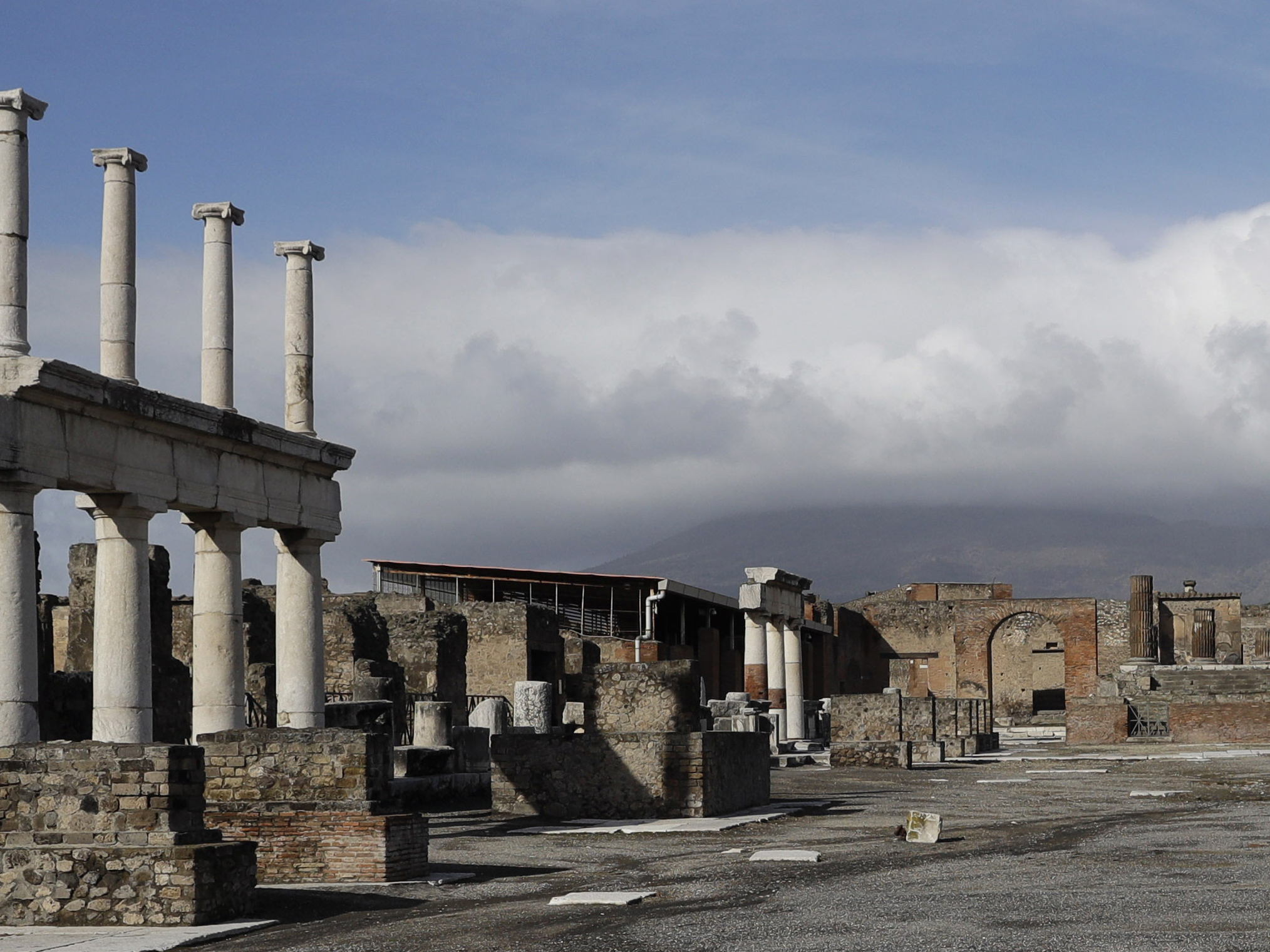 caption: Clouds hang over the Vesuvius volcano in Pompeii, southern Italy, Jan. 25, 2021.