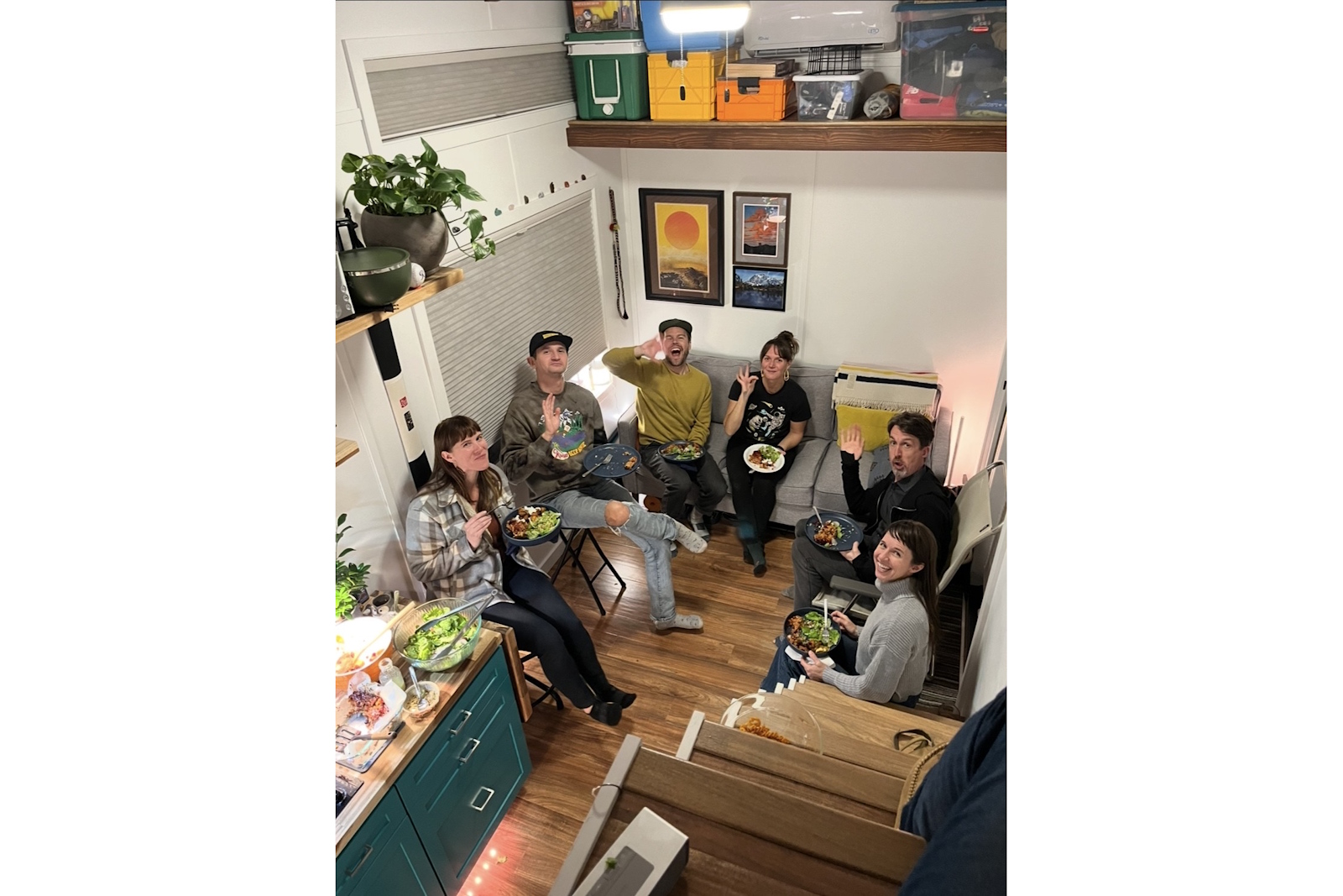 caption: Friends and neighbors gather in Jon Urlie's Tiny House on Wheels in Tacoma's Hilltop neighborhood.