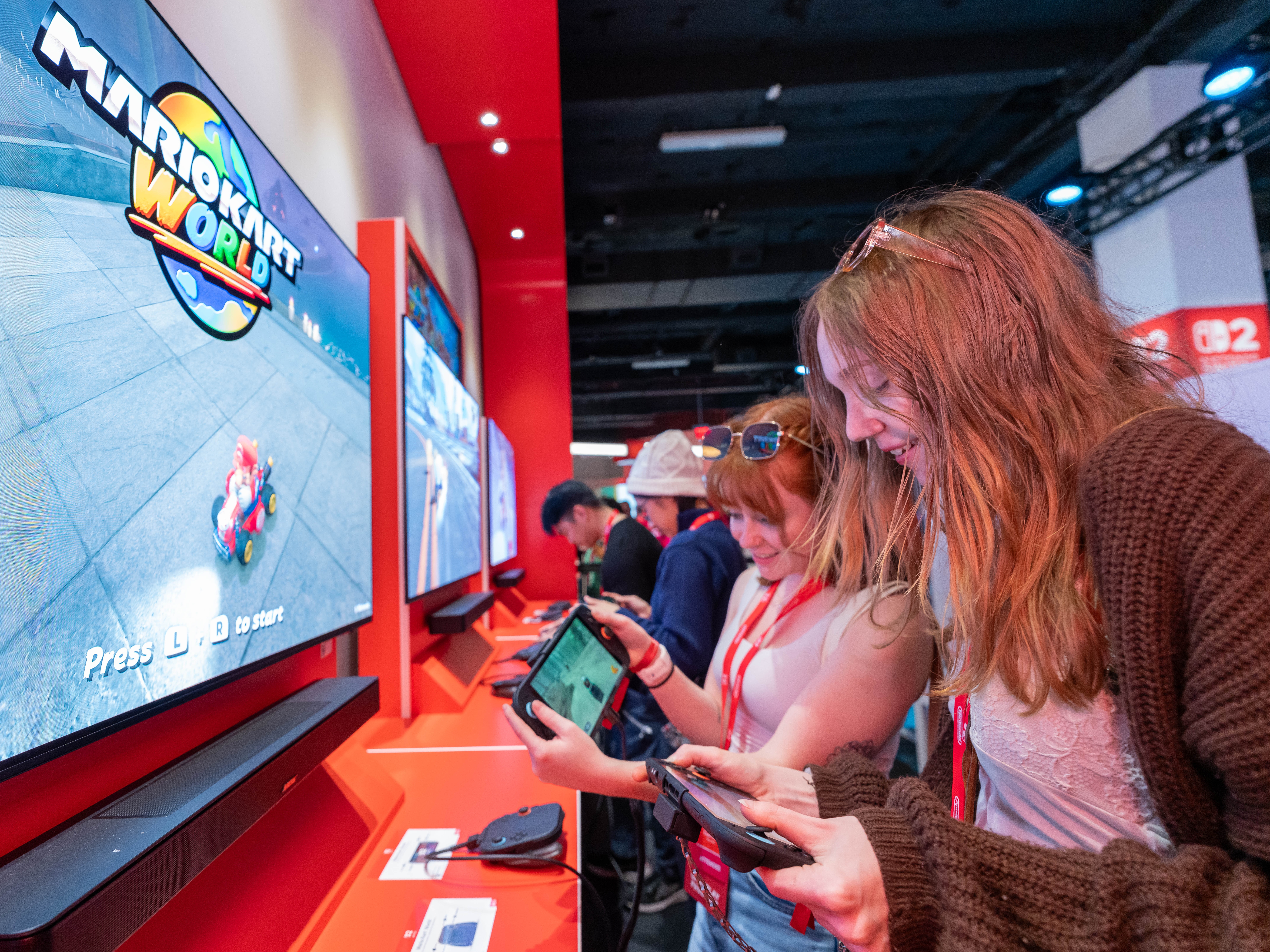 caption: Attendees at a New York City event previewing the Nintendo Switch 2.