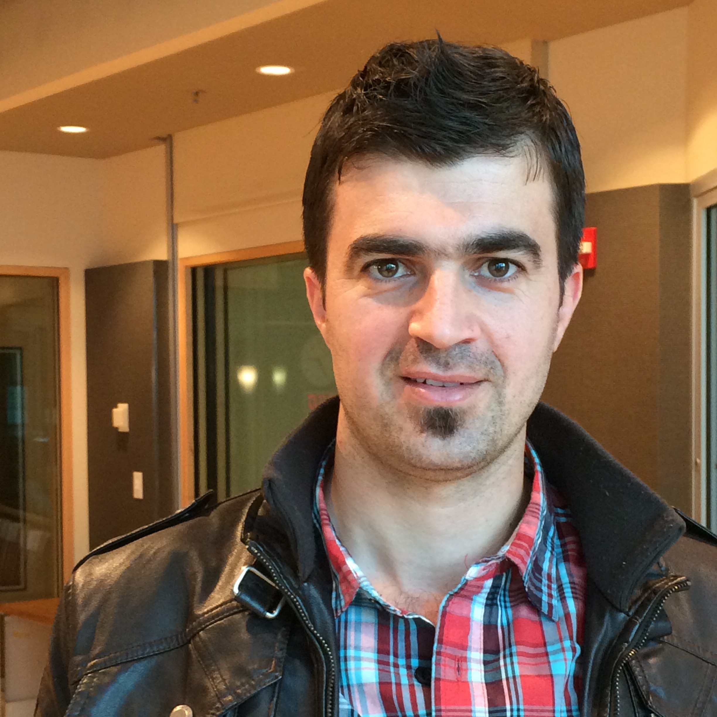 caption: Ranj Abudlsamad in the KUOW studios. 