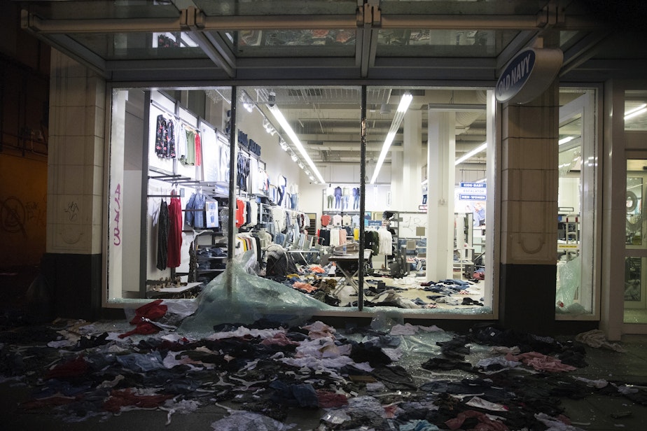 caption: Clothes are strewn across the sidewalk after Old Navy was vandalized following a protest on Saturday, May 30, 2020, in Seattle. Protesters gathered to express outrage at the violent police killing of George Floyd, a Black man who was killed by a white police officer who held his knee on Floyd's neck for 8 minutes and 46 seconds, as he repeatedly said, 'I can't breathe,' in Minneapolis on Memorial Day. 