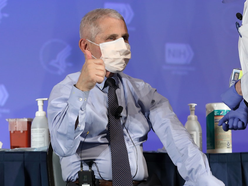 caption: U.S. infectious disease expert Dr. Anthony Fauci informed the WHO on Thursday that the U.S. will not be leaving the organization. Fauci is seen here last month, receiving the Moderna coronavirus vaccine in Washington.