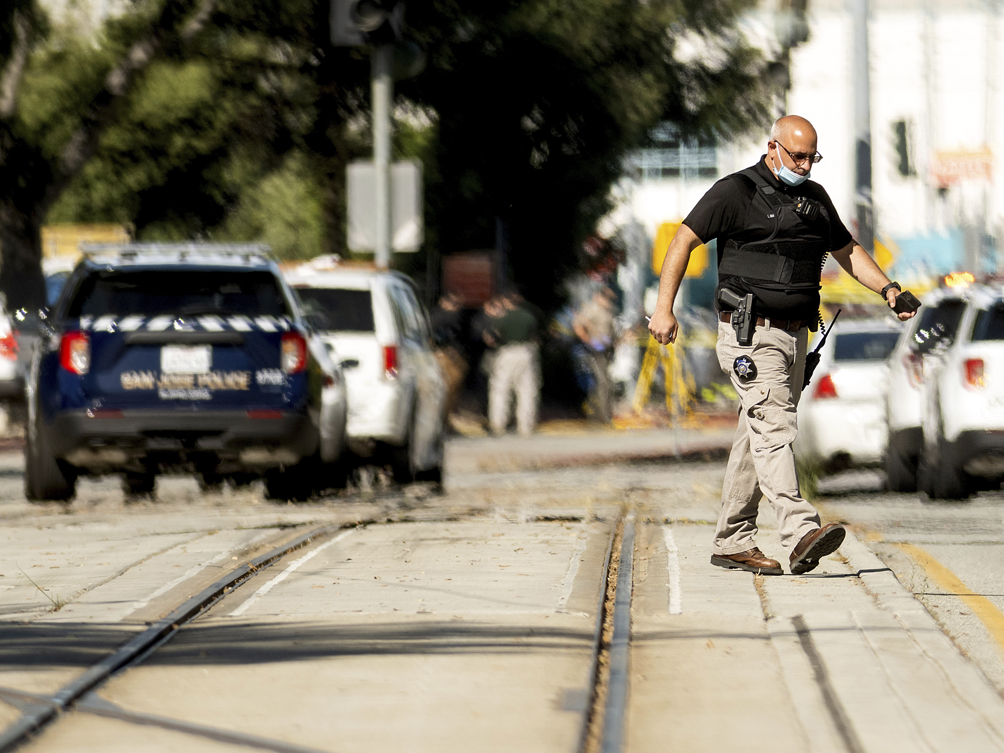 caption: Law enforcement officers respond to a mass shooting at a Santa Clara Valley Transportation Authority facility on Wednesday in San Jose, Calif. Santa Clara County sheriff's spokesman said the rail yard shooting left multiple people, including the shooter, dead.