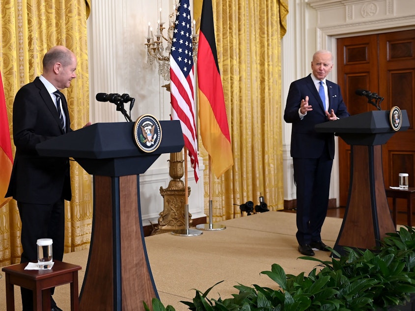 caption: President Biden speaks during a joint news conference with German Chancellor Olaf Scholz at the White House on Monday.