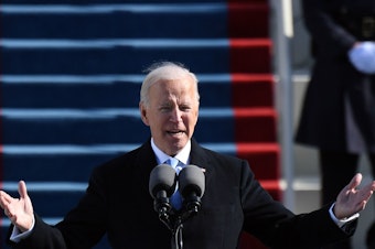 caption: U.S. President Joe Biden delivers his inauguration speech on January 20, 2021, at the U.S. Capitol in Washington, DC.