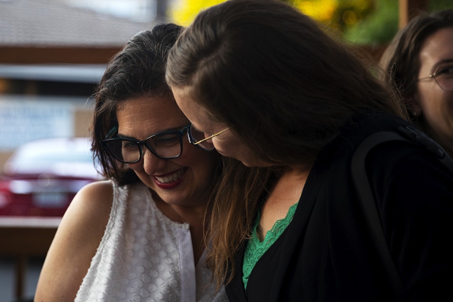 caption: Seattle City Council incumbent Tammy Morales, left, representing District 2, talks with supporters during a primary election night gathering on Tuesday, August 1, 2023, at Taco City Taqueria along Rainier Avenue South in Seattle. 