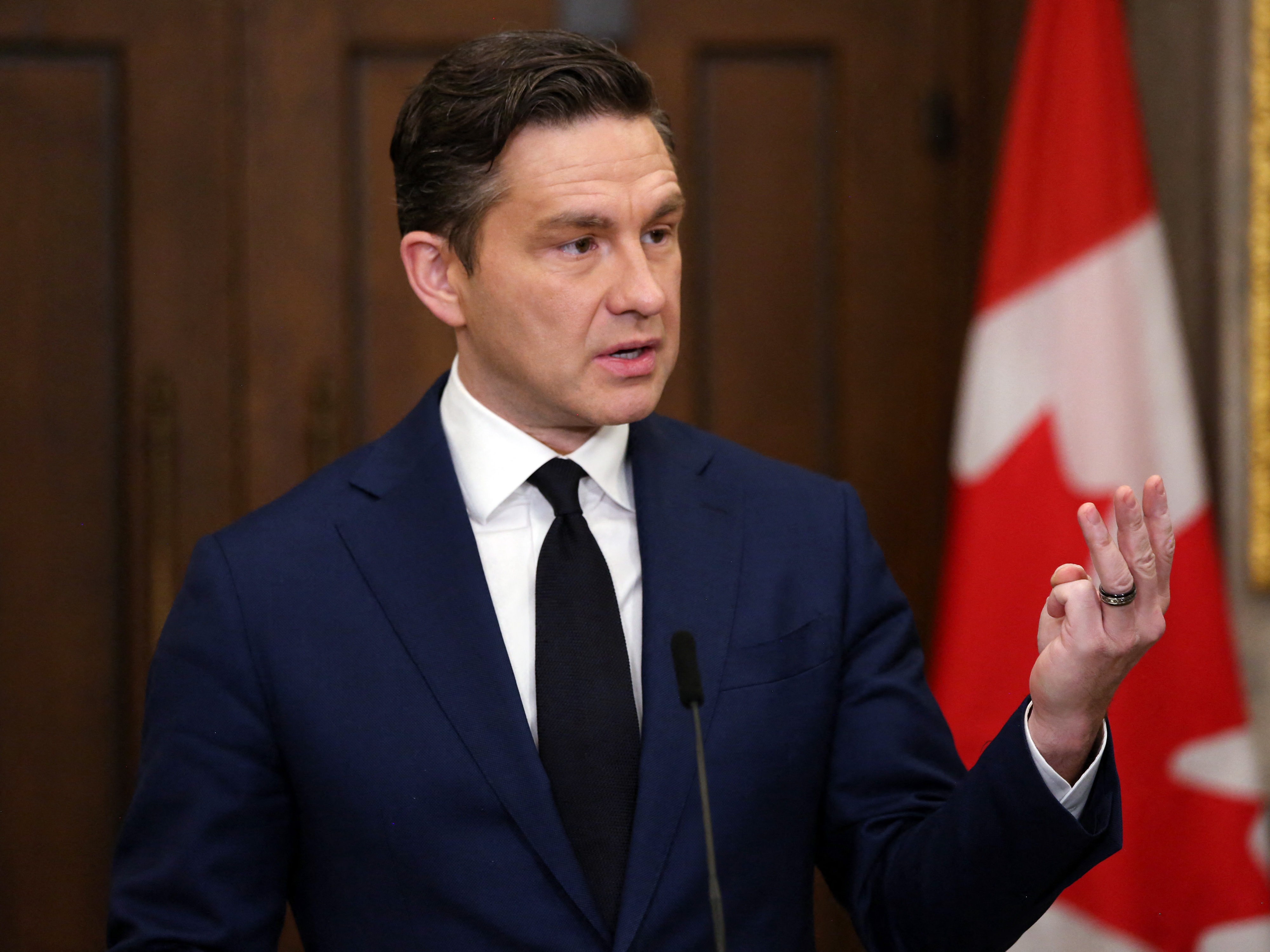 caption: Conservative Party leader Pierre Poilievre has built a sizeable lead in the race to be Canada's next prime minister. He's seen here in December, speaking at a news conference in Ottawa.