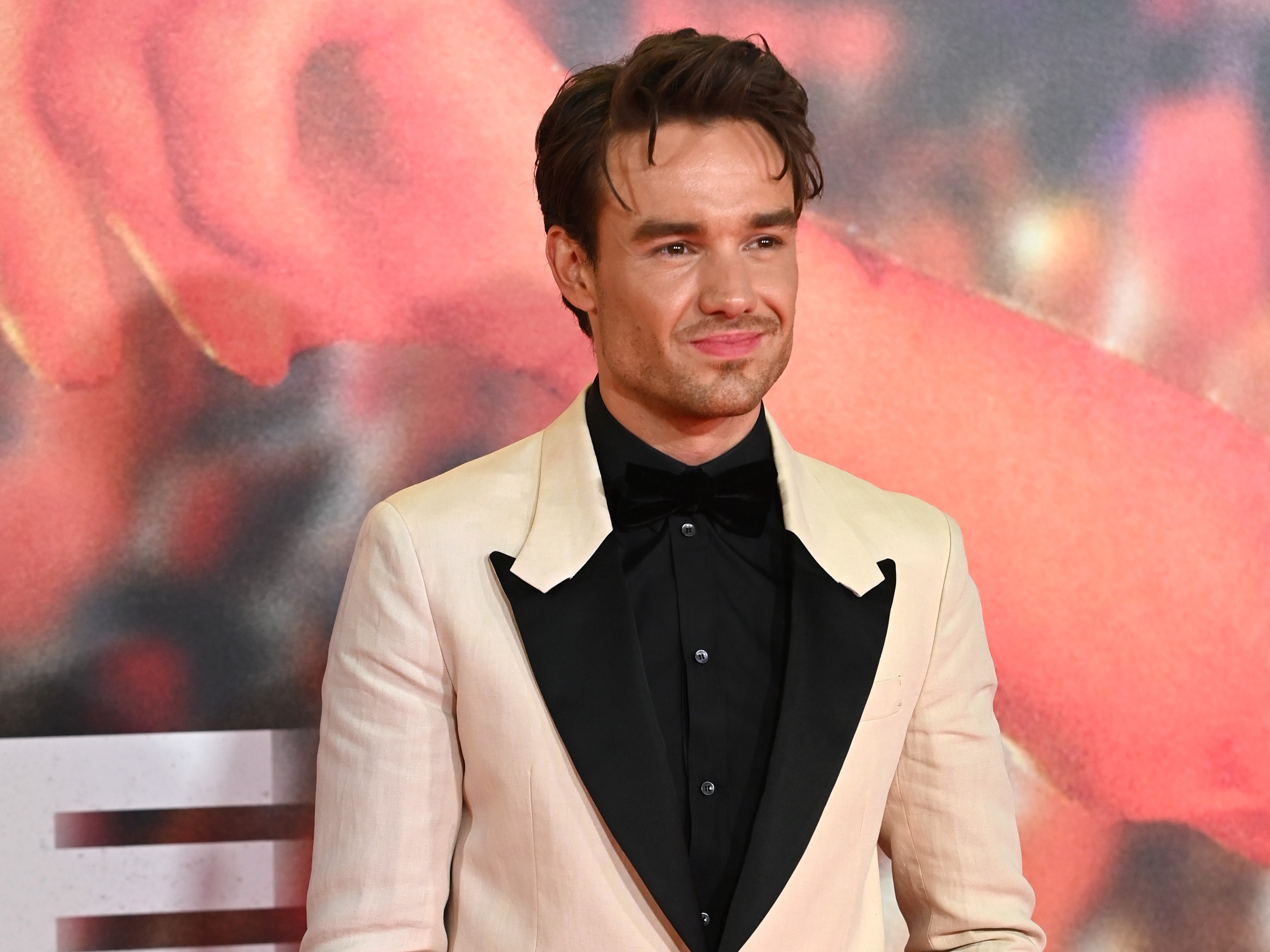 caption: Liam Payne, seen here at the 2023 premiere of the film <em>All of These Voices</em>, a documentary about his One Direction band mate Louis Tomlinson.