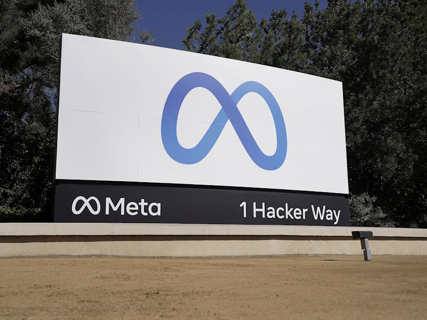 caption: Facebook's Meta logo sign at the company headquarters in Menlo Park, Calif., in 2021. Anyone in the U.S. who has had a Facebook account at any time since May 24, 2007, can now apply for their share of a $725 million privacy settlement that parent company Meta has agreed to pay. Meta is paying to settle a laws