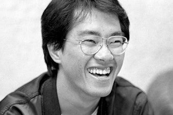 caption: This black and white photo taken in May 1982 shows Japanese manga artist Akira Toriyama, whose death was announced on March 8, 2024.