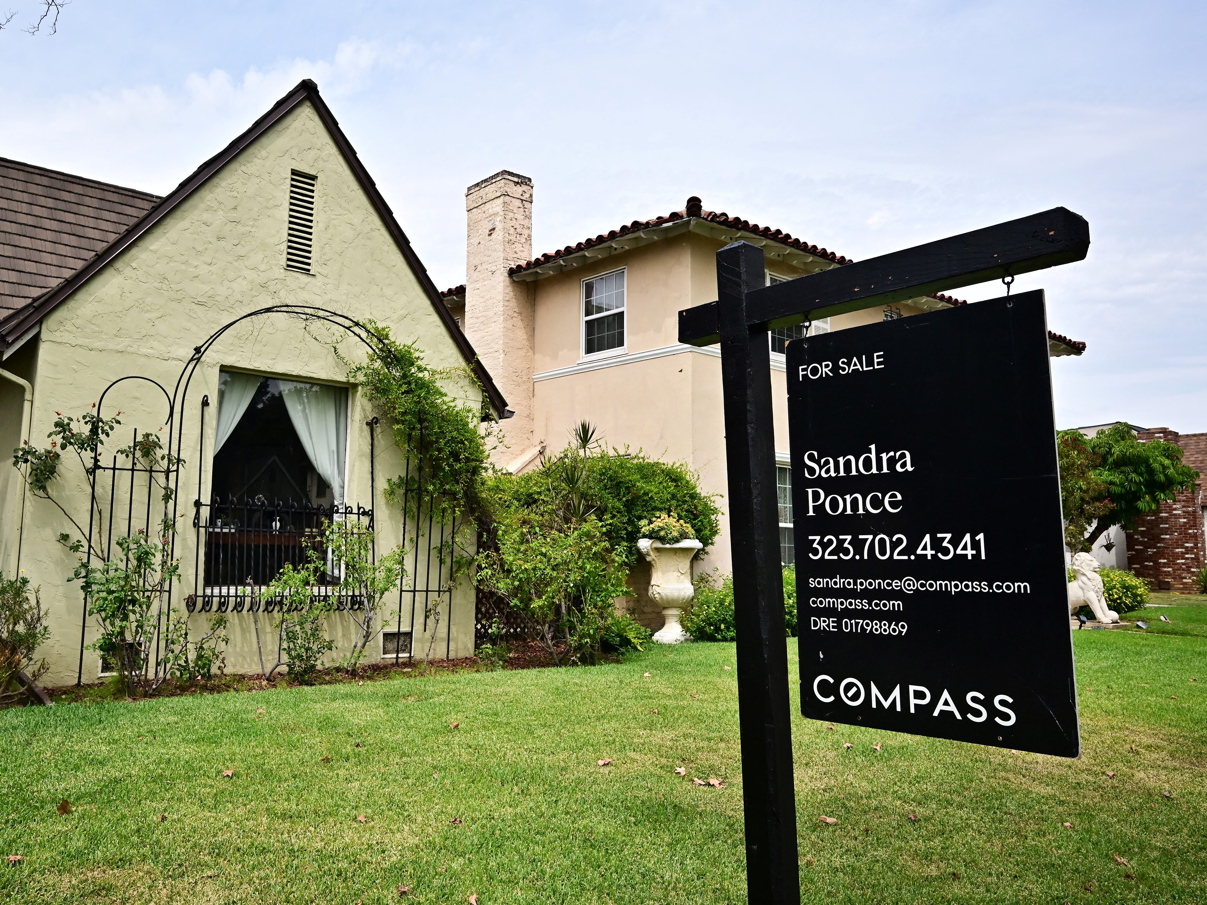 caption: There has been a spike in mortgage applications as interest rates have dropped to the lowest level since October 2024. Here, a home for sale in Alhambra, Calif., last month.