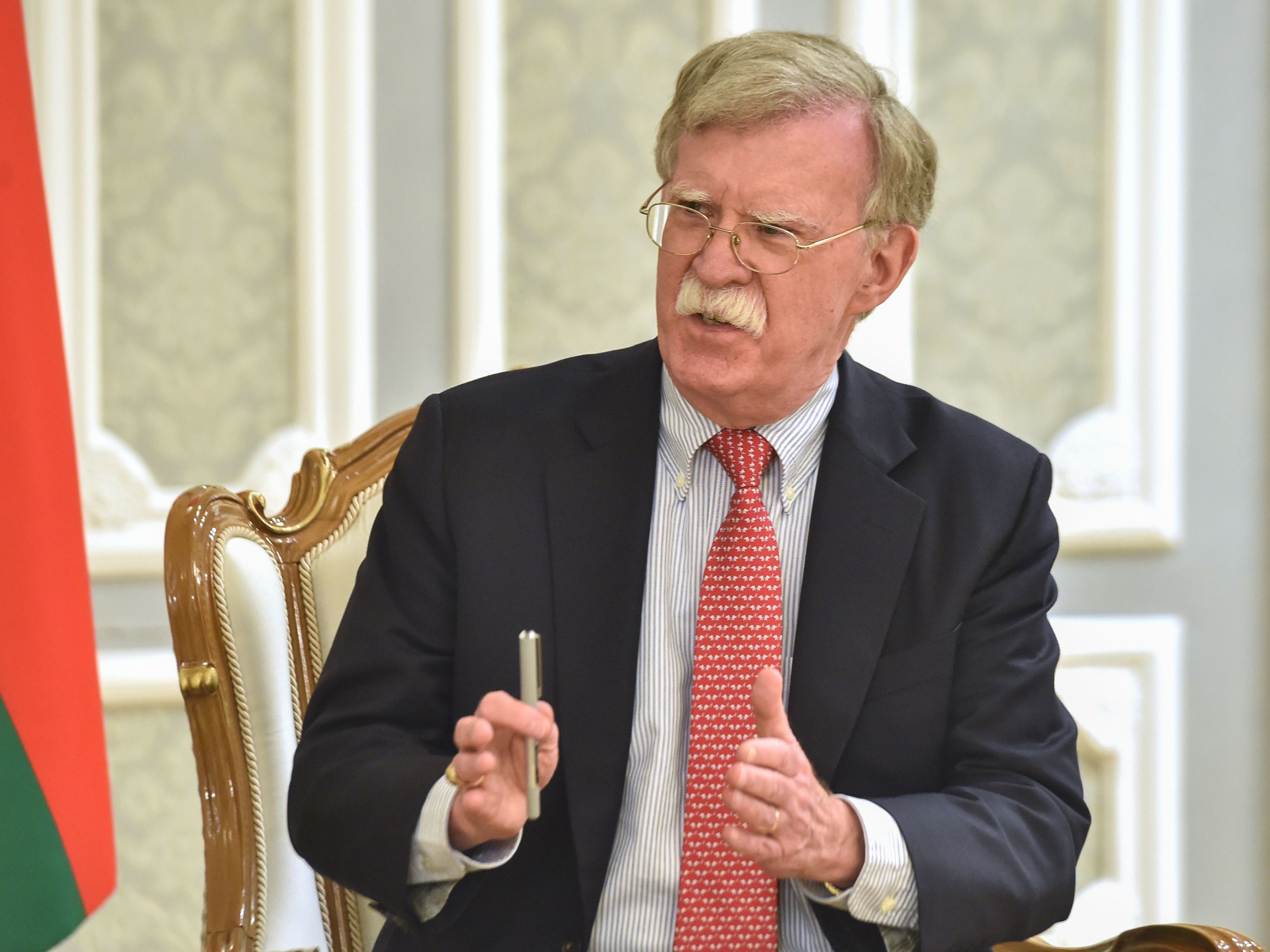 caption: Then-National Security Adviser John Bolton is seen in Minsk, Belarus, in 2019.