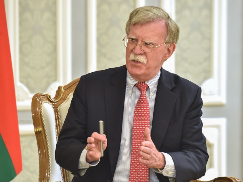 caption: Then-National Security Adviser John Bolton is seen in Minsk, Belarus, in 2019.