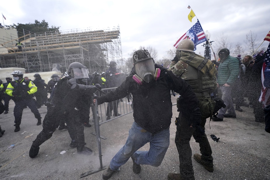 caption: Trump supporters try to break through a police barrier, Wednesday, Jan. 6, 2021, at the Capitol in Washington. As Congress prepares to affirm President-elect Joe Biden's victory, thousands of people have gathered to show their support for President Donald Trump and his claims of election fraud.