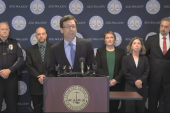 caption:  Washington Attorney General Bob Ferguson speaks at a news conference to announce the first convictions stemming from a forensic genealogy grant program his office created to help local police agencies solve cold cases. 