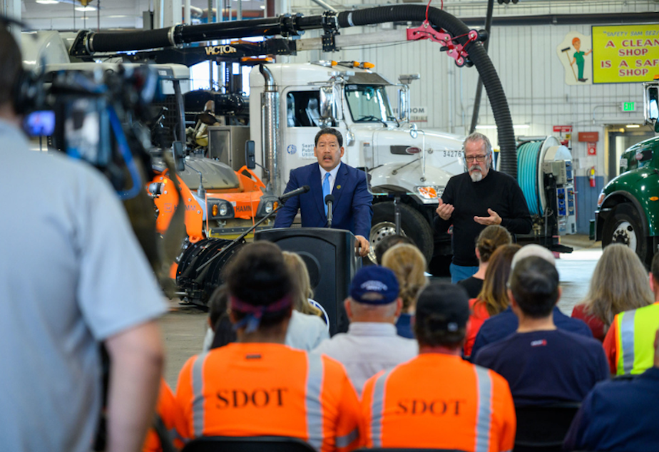 caption: Seattle Mayor Bruce Harrell introduces his 2023-24 budget proposal while speaking to a crowd of city employees at the Charles Street Vehicle Maintenance Facility, Sept. 27, 2022. 