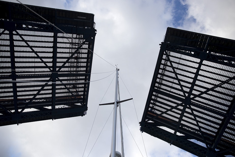 caption: Hallberg-Rassy sailboat travels underneath the Fremont Bridge on Wednesday, November 7, 2018, in Seattle.