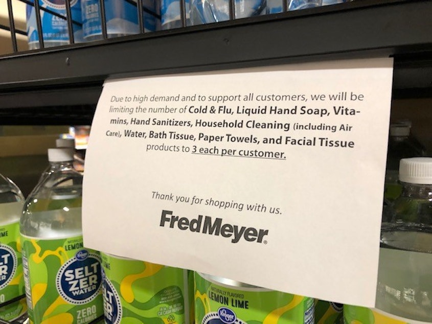 caption: A sign at a Seattle Fred Meyer amid the local COVID-19 outbreak. 
