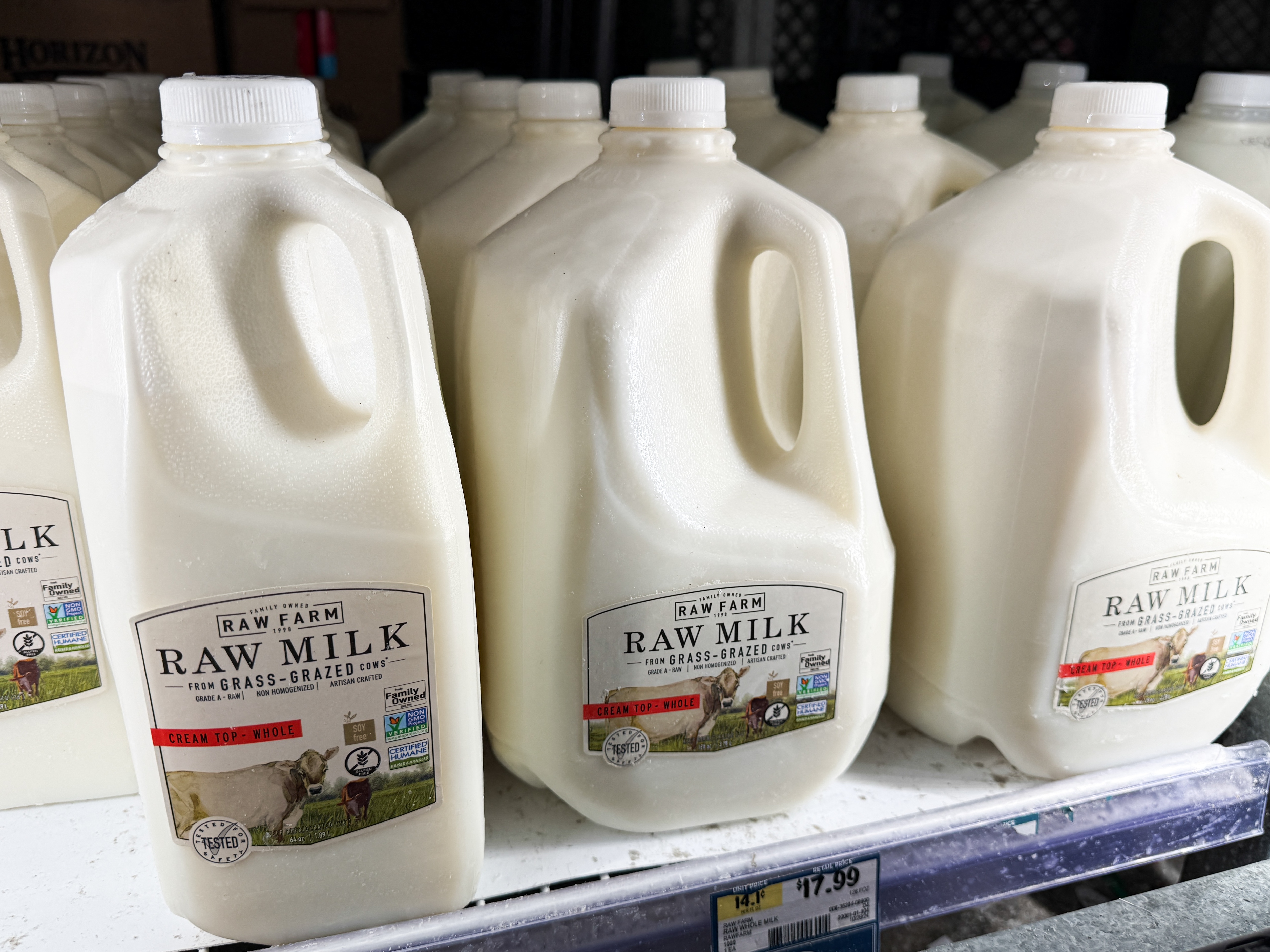 caption: Raw milk from Raw Farm is displayed for sale at a grocery store in Torrance, Calif., on Nov. 29.
