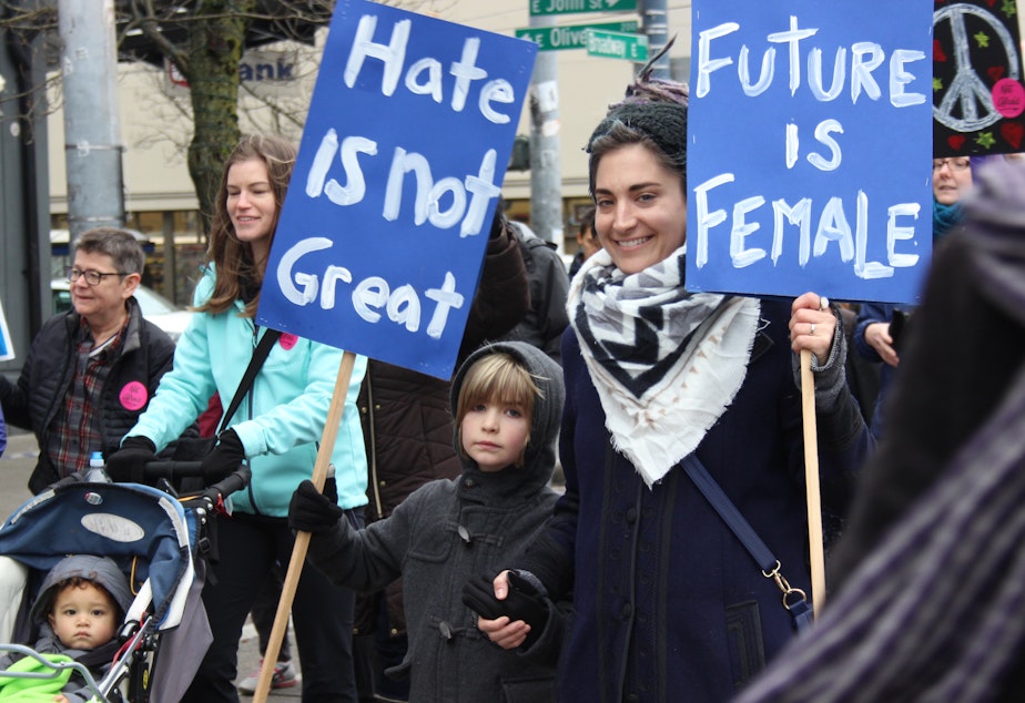 caption: People at a women's march on Seattle's Capitol Hill on Dec. 3.