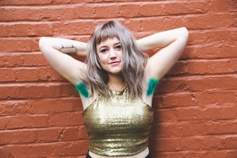 caption: An armpit dye model. Roxie Hunt of Vain salon in downtown Seattle started dying friend's armpits in bright Kool-Aid colors. That little experiment garnered international attention.
