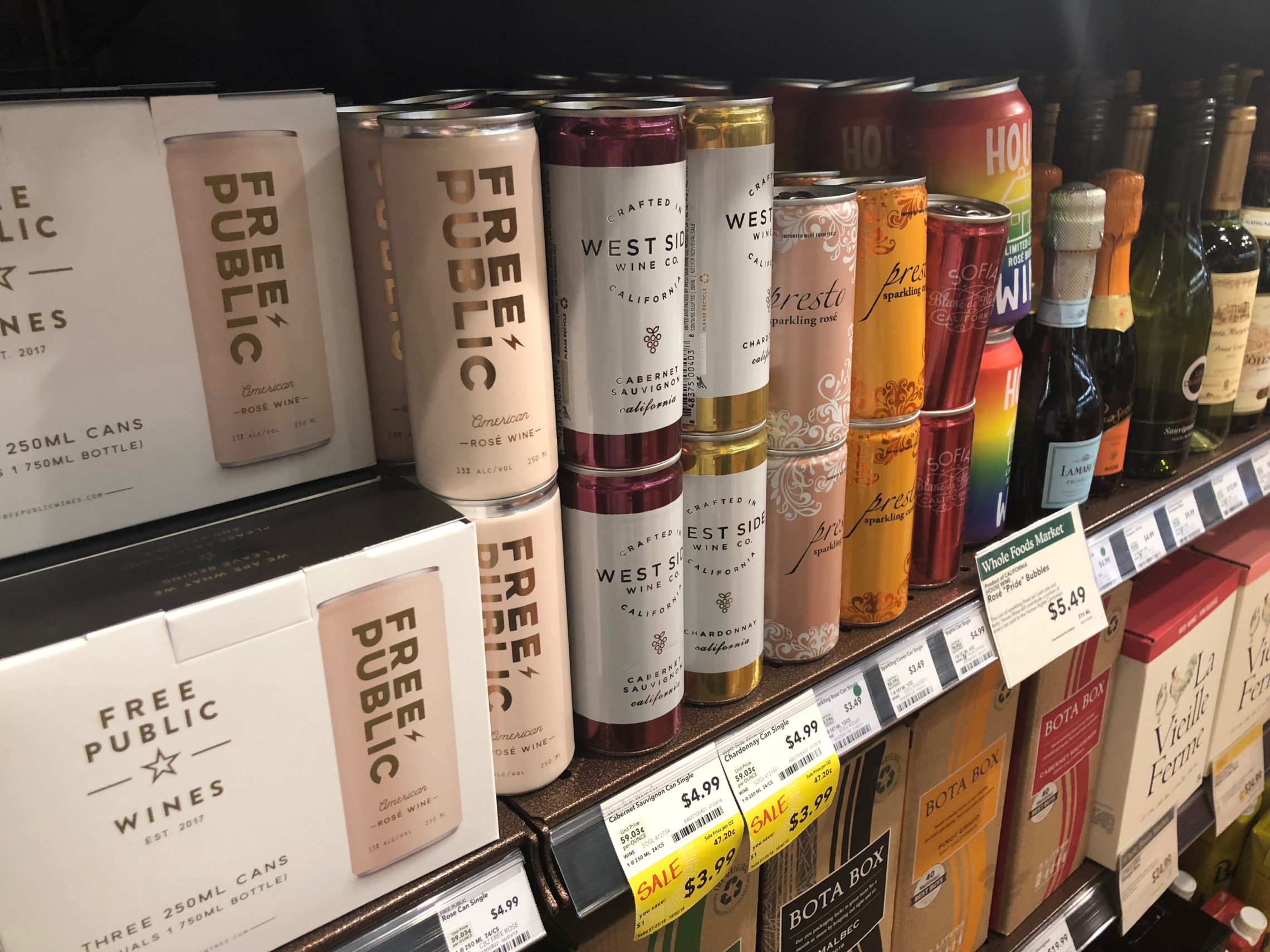 caption: Stores like this busy Whole Foods in Portland, Ore., have started shuffling bottles around on shelves and in coolers to make room for wine in cans. CREDIT: ANNA KING/N3