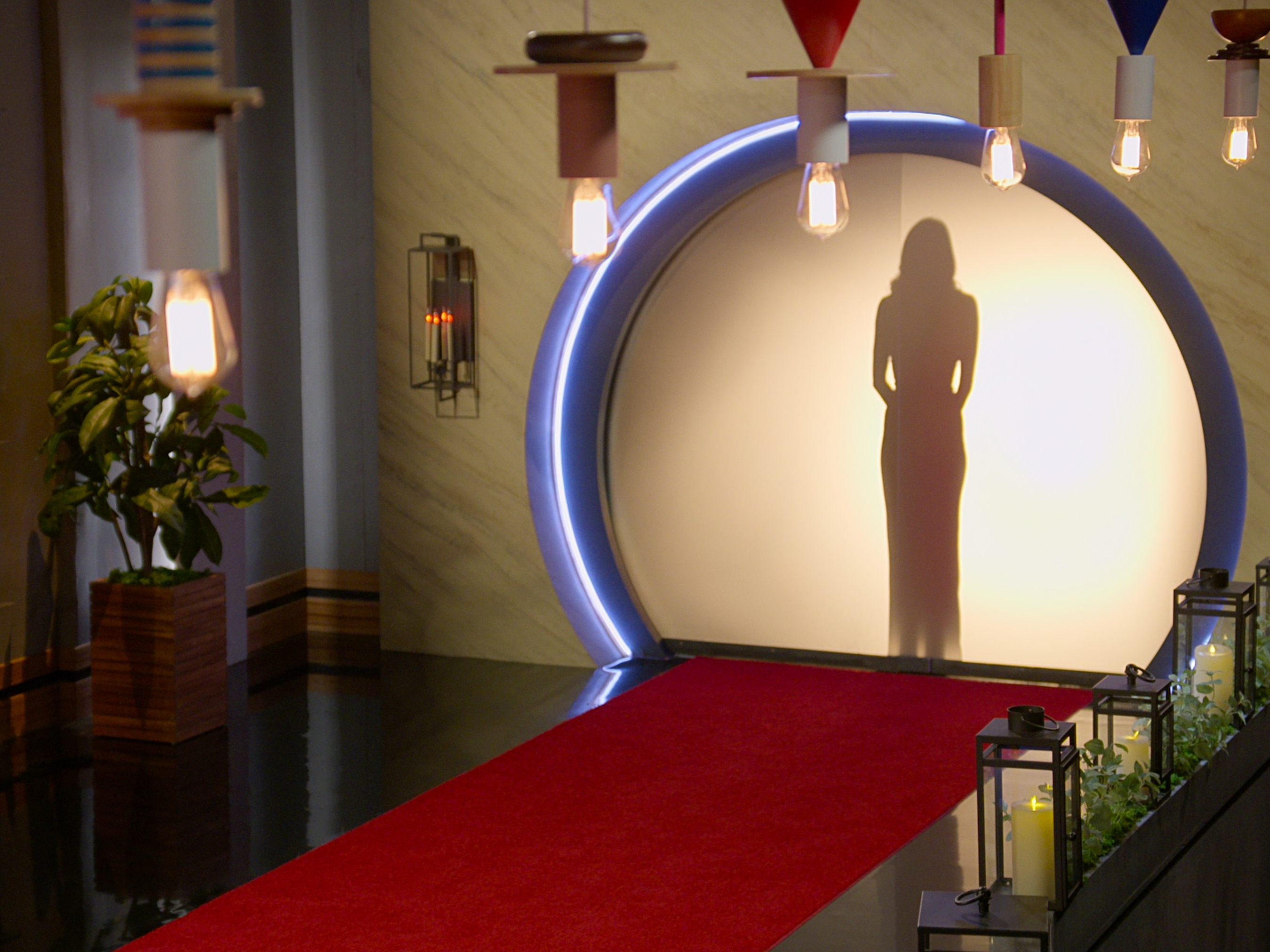 caption: The Netflix reality series <em>Love Is Blind</em> sees singles match up after days of dating while separated by a wall. The National Labor Relations Board says the show's cast members should be considered employees.