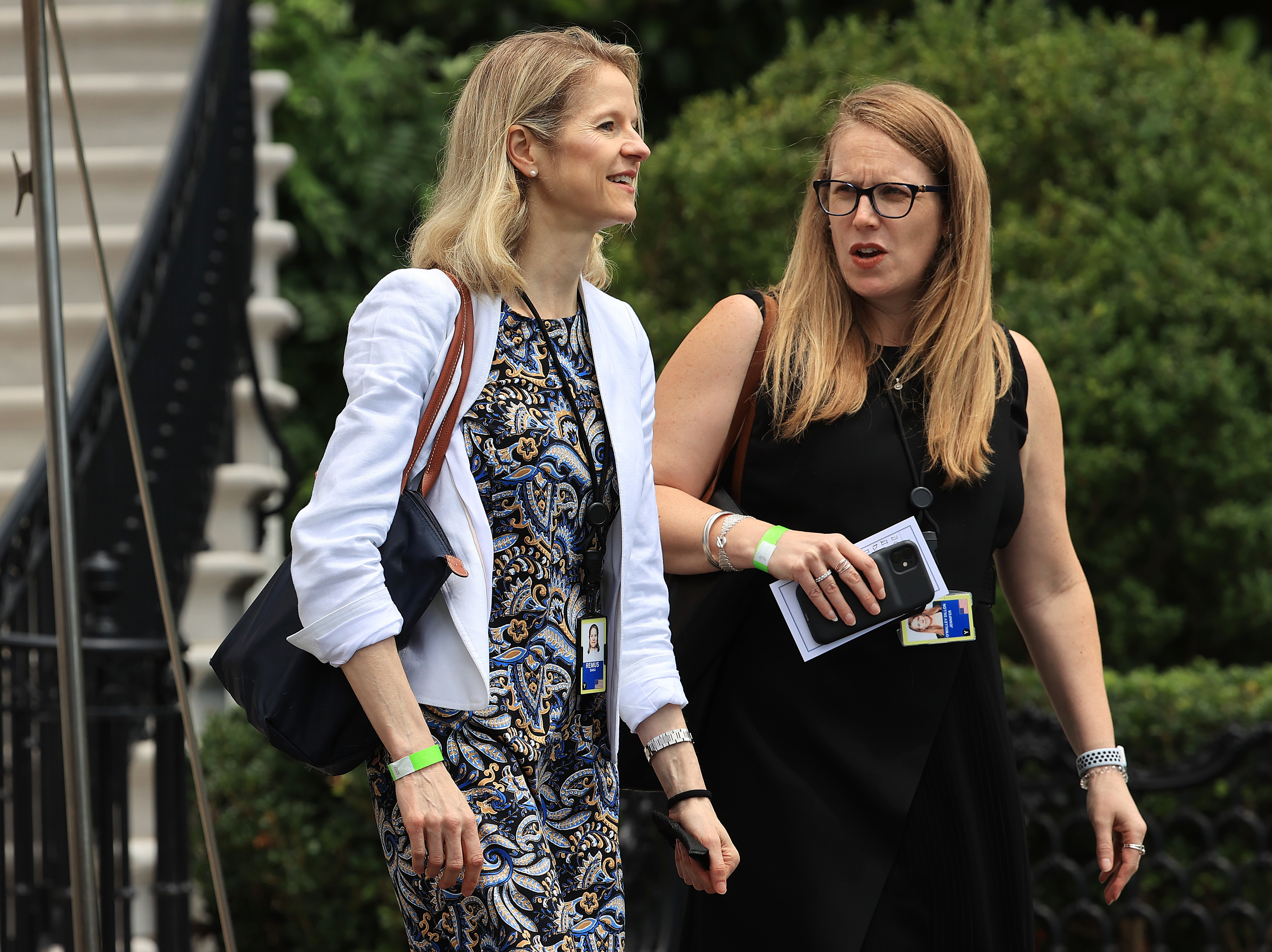 caption: White House counsel Dana Remus (left) and Deputy Chief of Staff Jennifer O'Malley Dillon depart the White House on July 13, 2021. Remus is the "quarterback" of the effort to nominate a Black woman to serve on the Supreme Court.