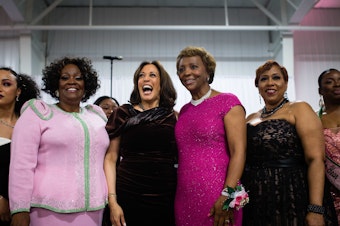 caption: Sen. Kamala Harris stands with attendees and participates in the Alpha Kappa Alpha Sorority Inc. hymn at their Annual Pink Ice Gala in Columbia, South Carolina on Friday, Jan. 25, 2019.