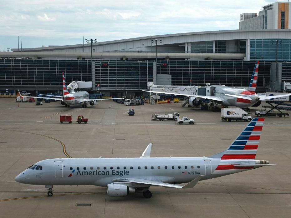 caption: An airline worker died on Saturday after being "ingested" into the engine of American Airlines Embraer 175 aircraft, like the kind pictured here at the Dallas/Fort Worth International airport in Dallas in June 2021.
