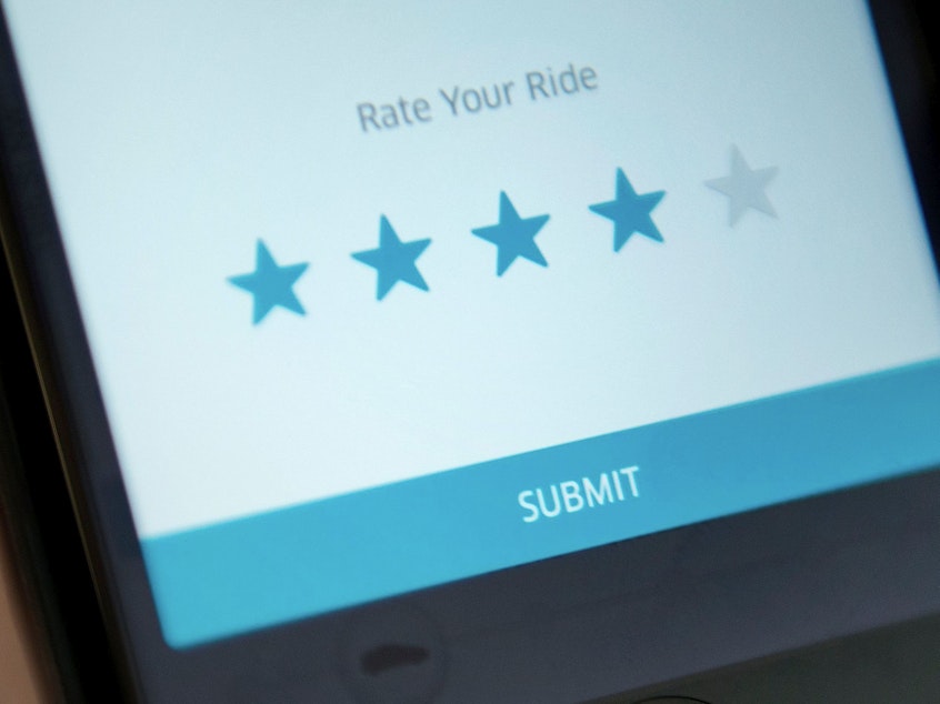 caption: A new federal lawsuit alleges that Uber's "star rating" system discriminates against drivers of color and drivers with accents. According to the suit, Uber terminates drivers whose ratings get too low.