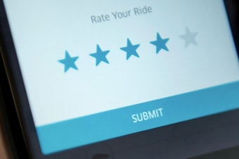 caption: A new federal lawsuit alleges that Uber's "star rating" system discriminates against drivers of color and drivers with accents. According to the suit, Uber terminates drivers whose ratings get too low.