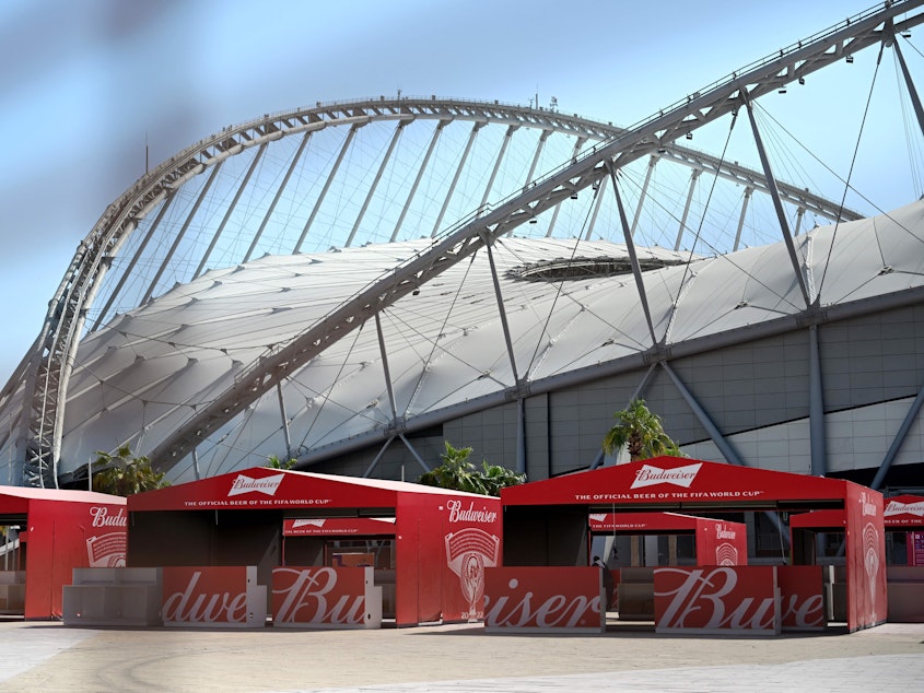 caption: Budweiser beer kiosks are pictured at the Khalifa International Stadium in Doha ahead of the Qatar 2022 World Cup soccer tournament, which starts Sunday. Beer sales will now be banned at the tournament.