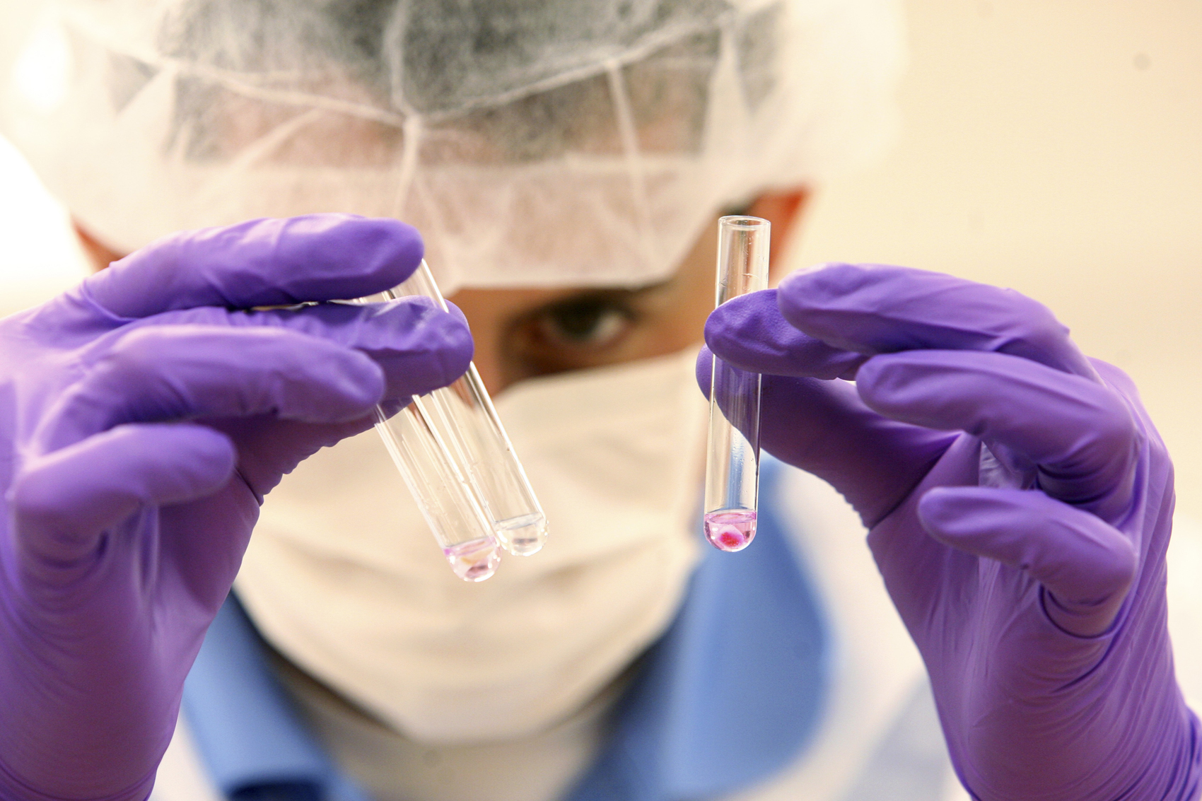 caption: A criminalist examines for DNA evidence at a lab in the NYC Office of Chief Medical Examiner, Friday, June 4, 2010, in New York. (Mary Altaffer/AP)