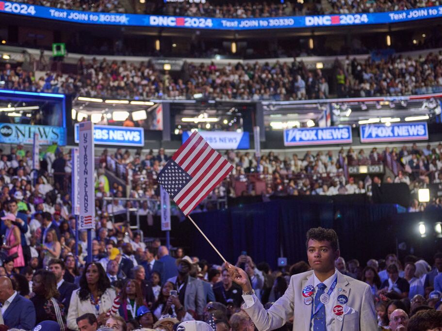 caption: The Harris campaign hopes that young voters like this one can be mobilized to vote for her during the election season. 