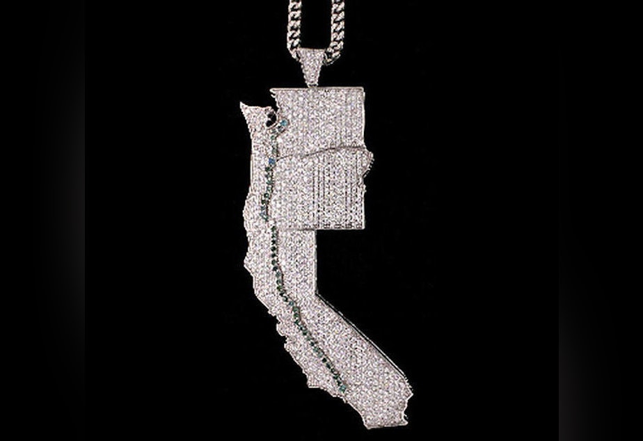caption: Jevon Lawson wore a diamond pendant with pale green gems mimicing the OxyContin trail from Los Angeles to Washington state. 