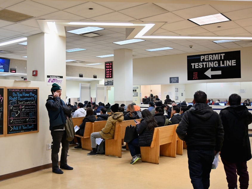 caption: DMV offices around the U.S. were slowed down for hours on Monday, due to a network outage in a key database. Here, people wait at the New York State Department of Motor Vehicles office in  Brooklyn last month.
