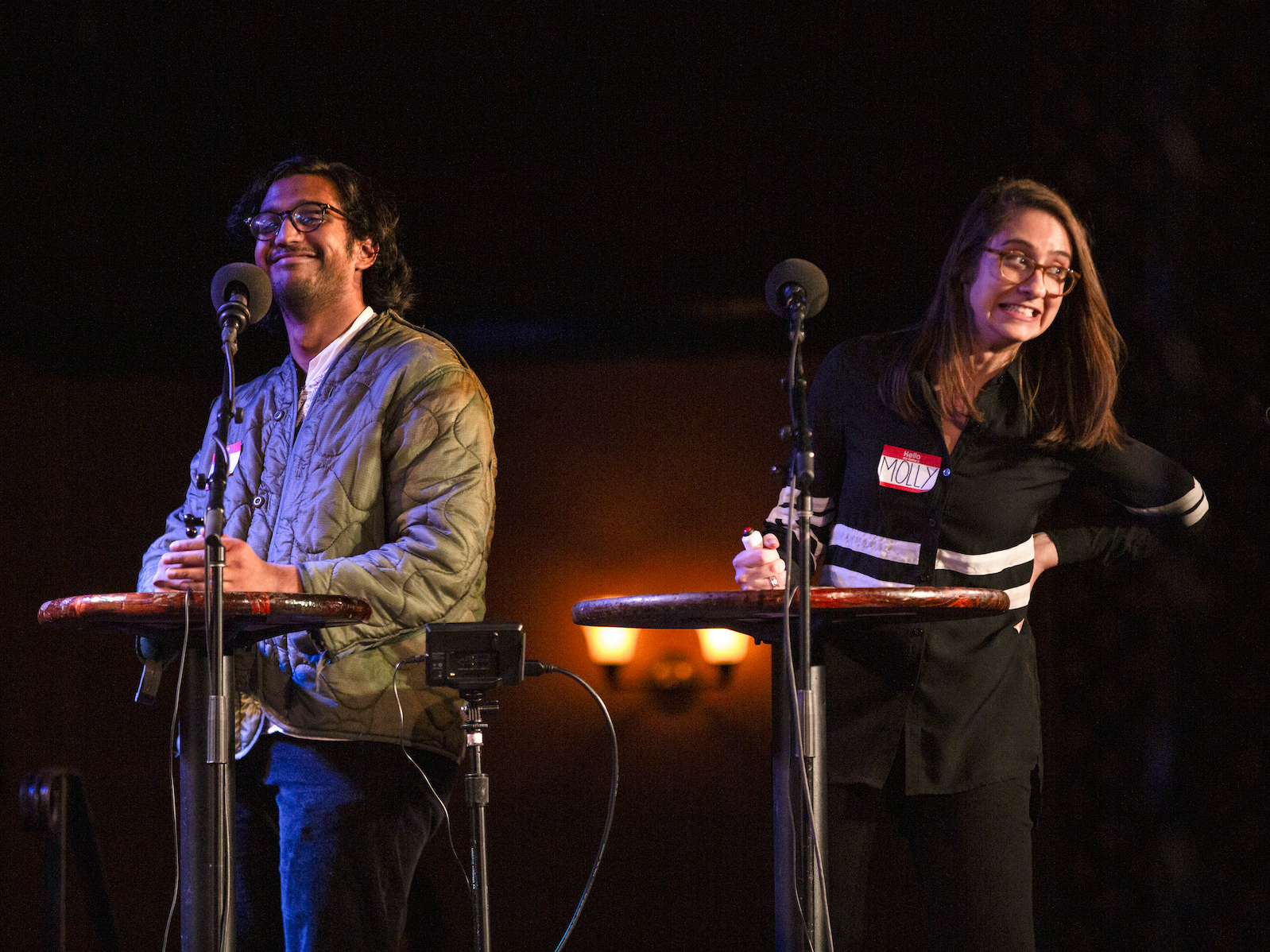 caption: Daniel Varghese and Molly Rubin play games on <em>Ask Me Another</em> at the Bell House in New York.
